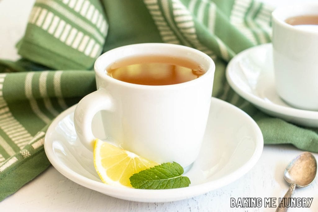 honey citrus mint tea recipe in white porcelain tea cup on saucer