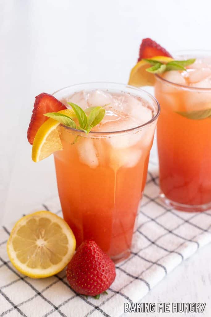 strawberry basil lemonade recipe in two glasses with garnish