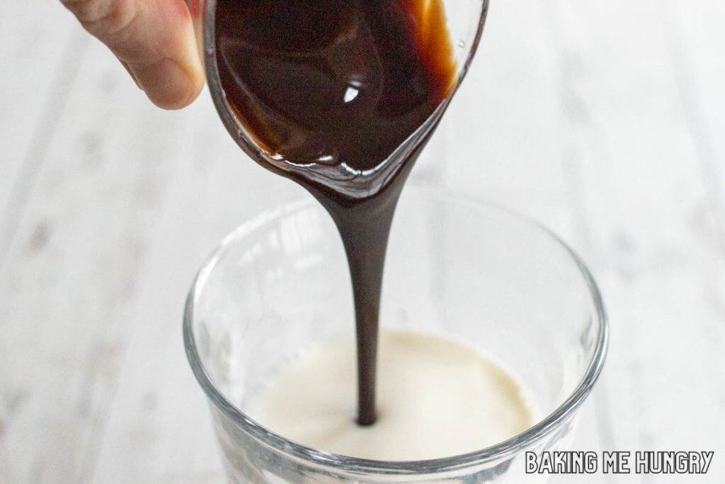 chocolate syrup being added