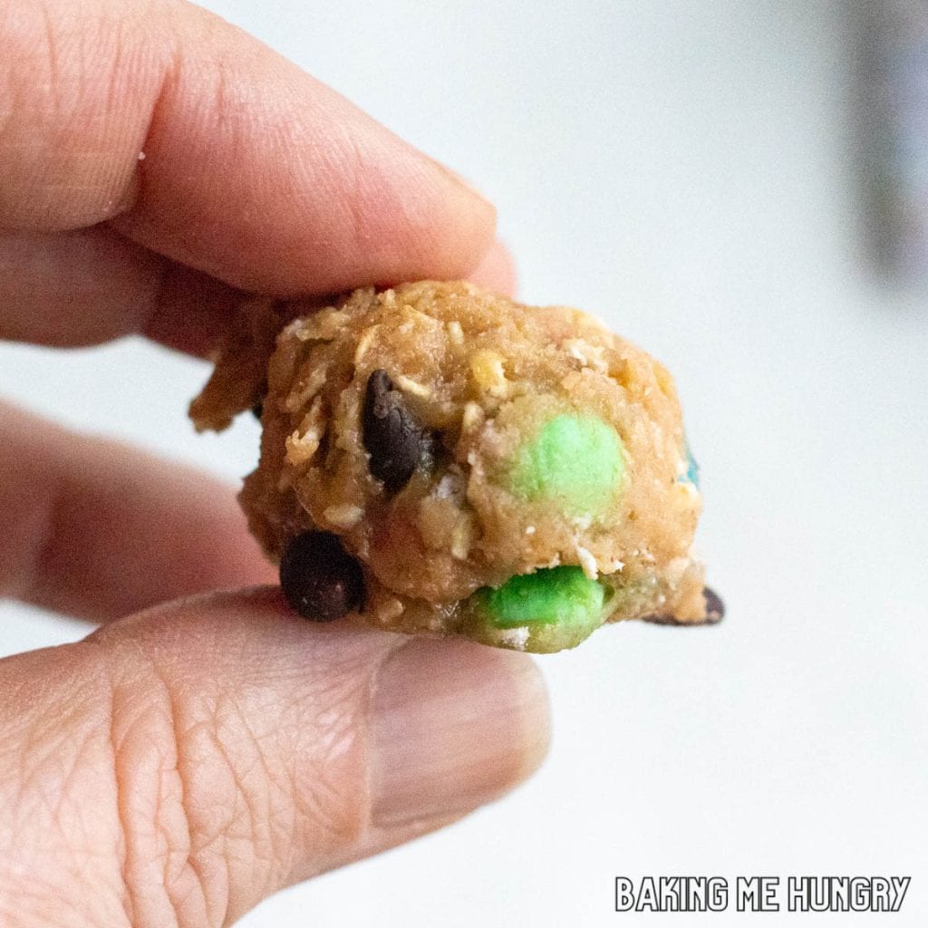 hand holding one of the monster cookie dough bites