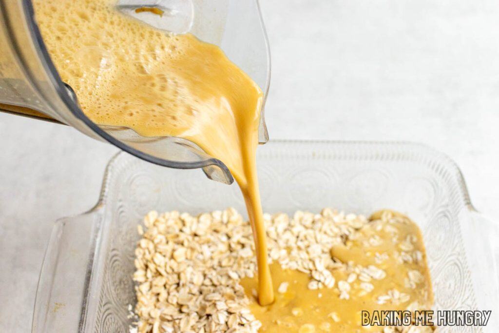 liquid being poured over oatmeal in baking dish