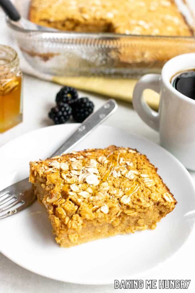 peanut butter baked oats on a plate with baking dish behind