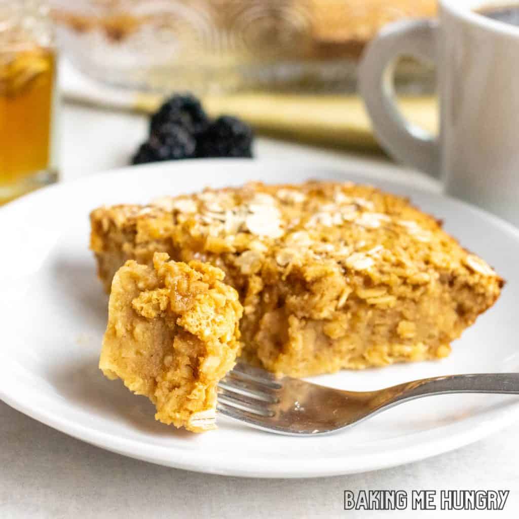 peanut butter baked oats on a plate with a bite on a fork