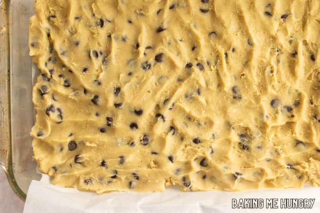 dough pressed into a baking pan