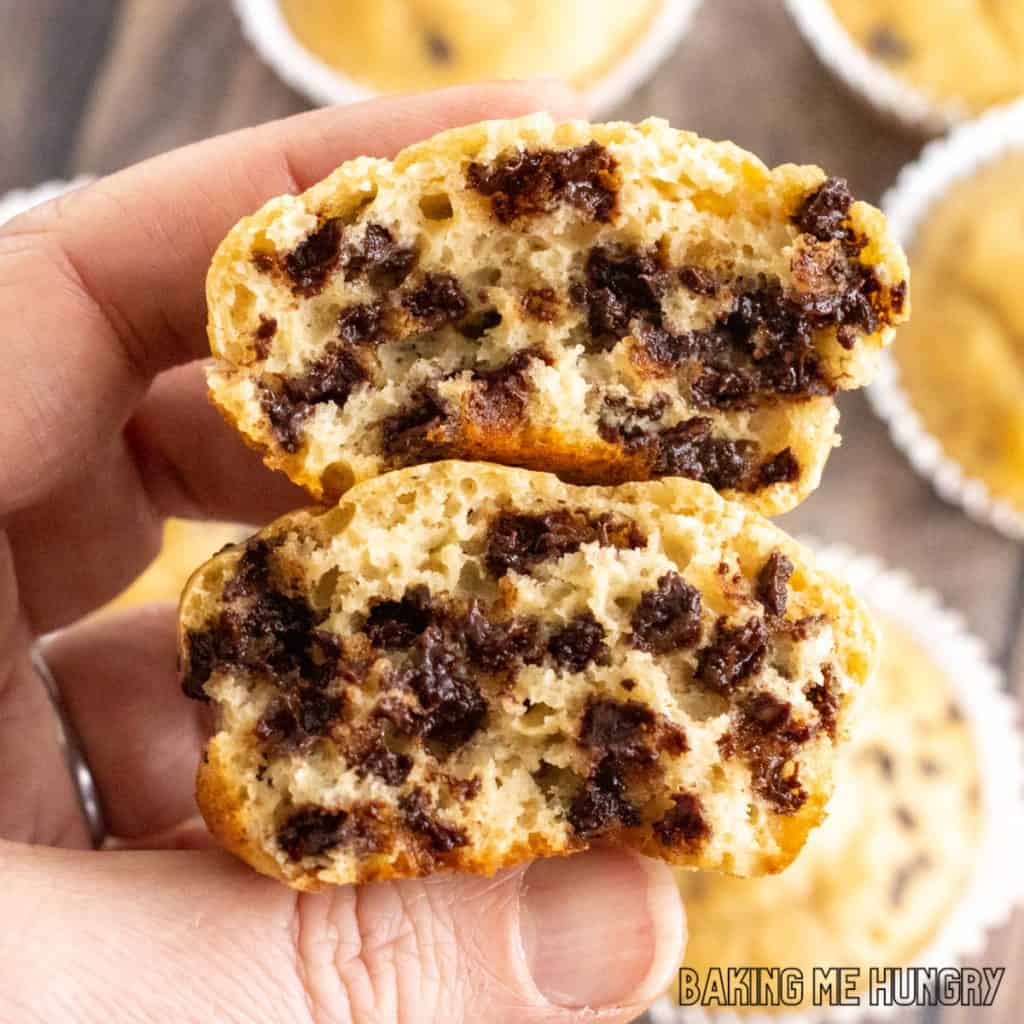 kodiak cake muffins recipe with hand holding halved muffins with chocolate chips