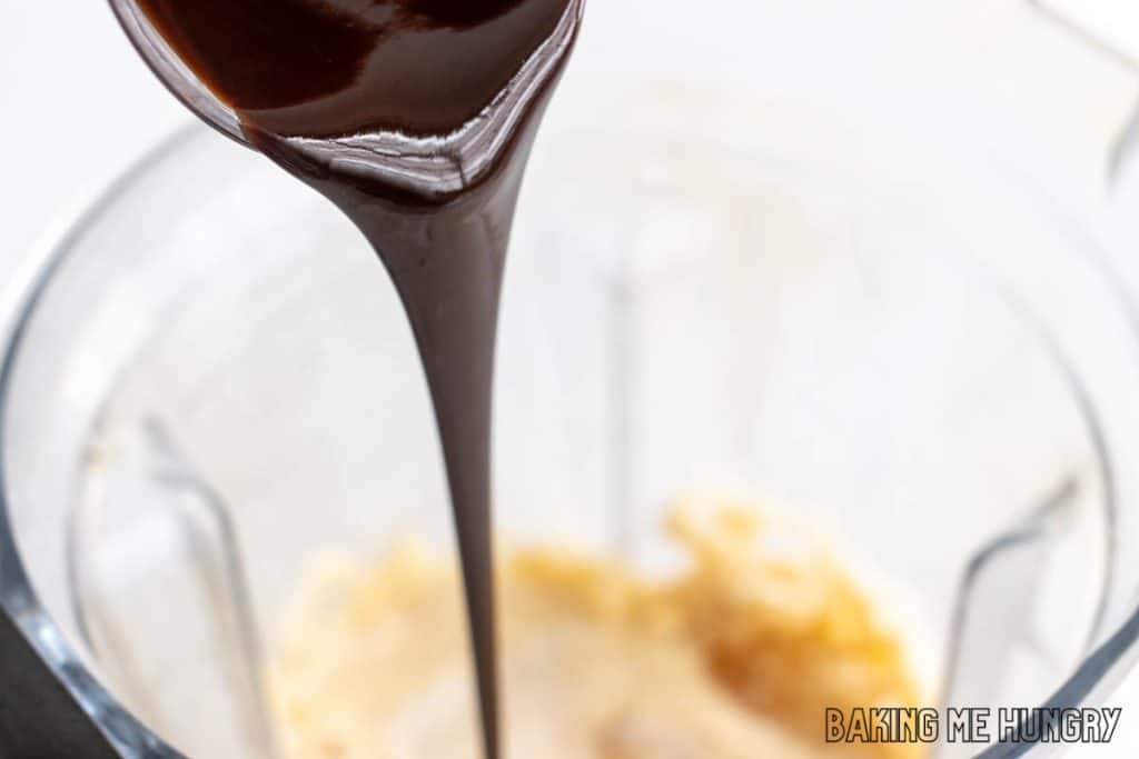 chocolate syrup being added