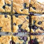 blueberry blondies recipe cut into bars on cutting board