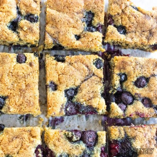 blueberry blondies recipe cut into bars on cutting board