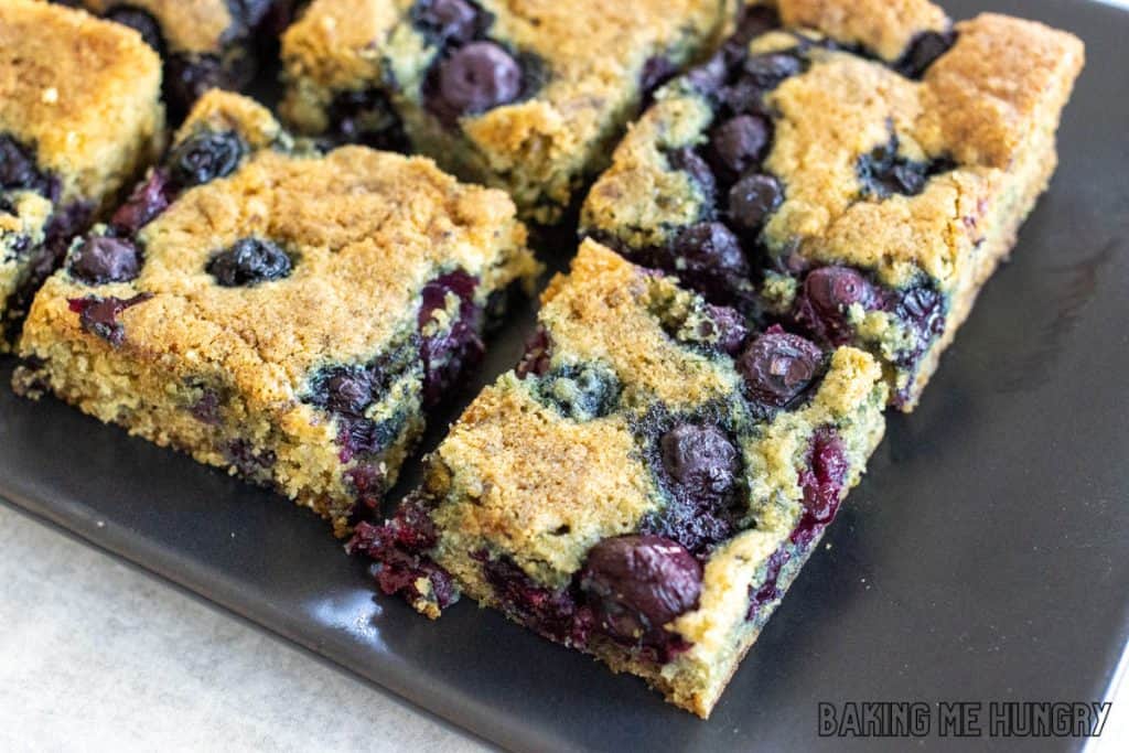 diagonal shot of blueberry blondie bars on serving platter
