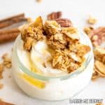 cinnamon granola recipe served on top of yogurt with honey drizzle close up