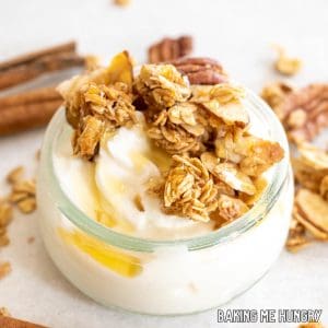 cinnamon granola recipe served on top of yogurt with honey drizzle close up