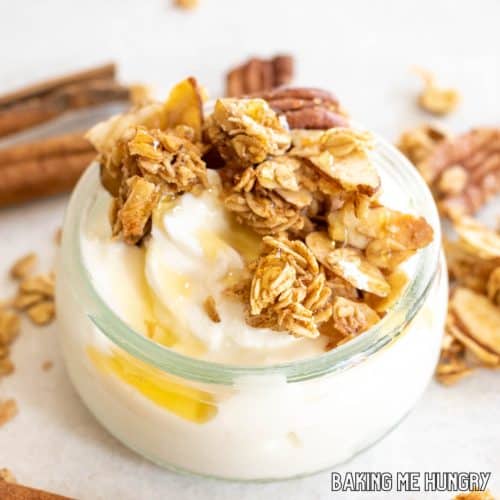 cinnamon granola recipe served on top of yogurt with honey drizzle close up