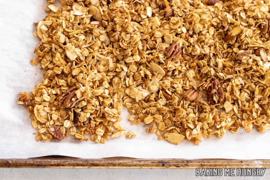 cinnamon granola recipe on parchment lined baked sheet