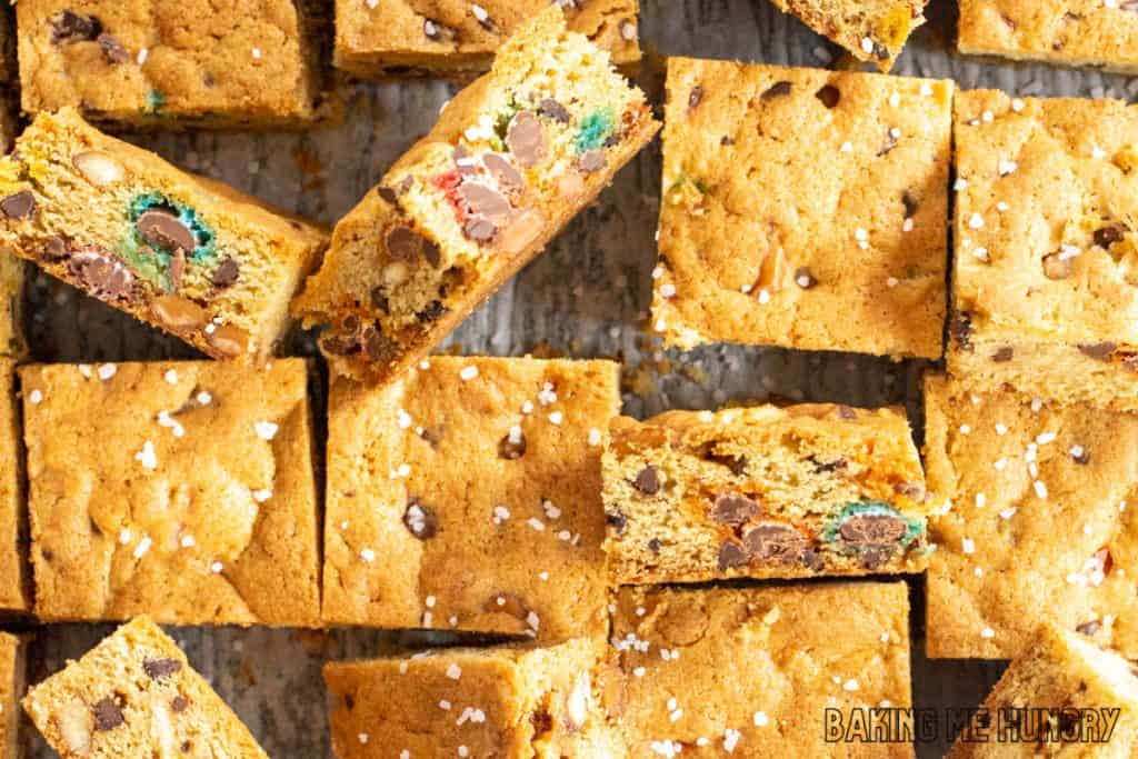 kitchen sink cookie bars cut into squares on cutting board with some on their sides