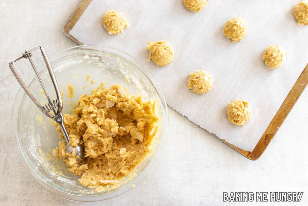 dough in bowl with cookie scoop