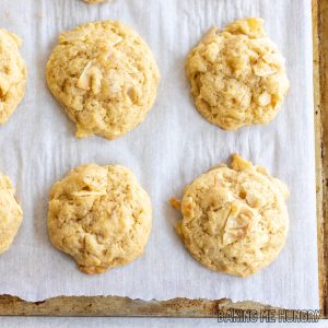 pineapple coconut cookies on parchment paper on baking sheet close up