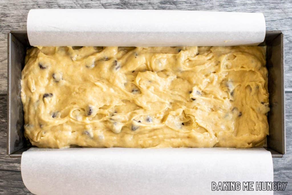 batter in loaf pan lined with parchment