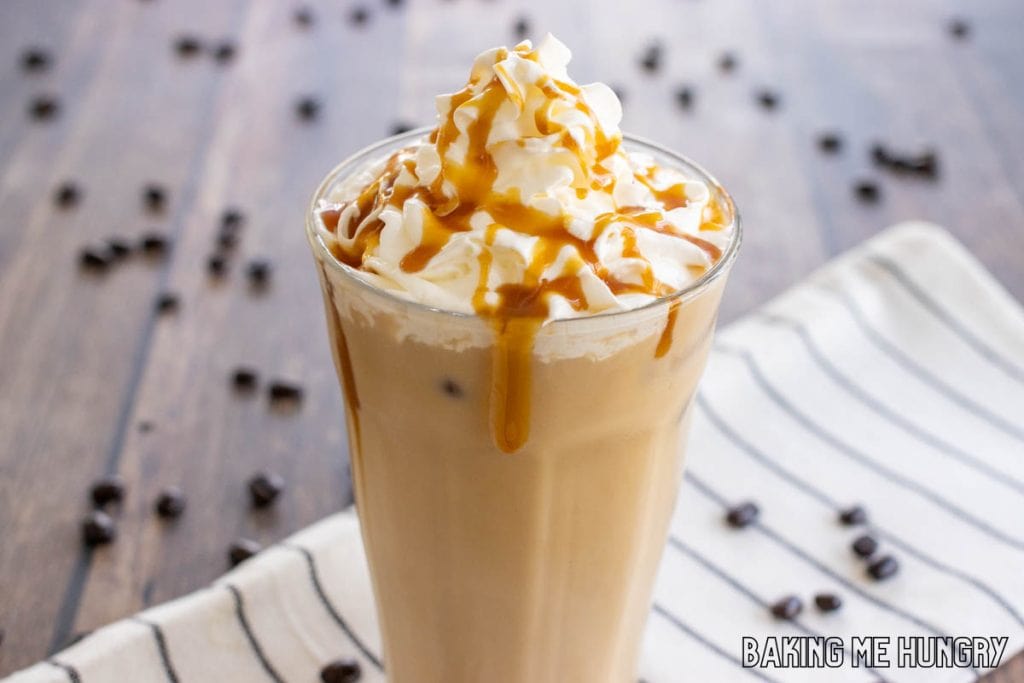 caramel iced coffee recipe topped with whipped cream and syrup in glass
