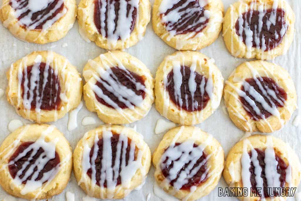lemon raspberry cookie recipe with lemon glaze on parchment paper