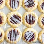 lemon raspberry cookie recipe with lemon glaze close up on parchment paper