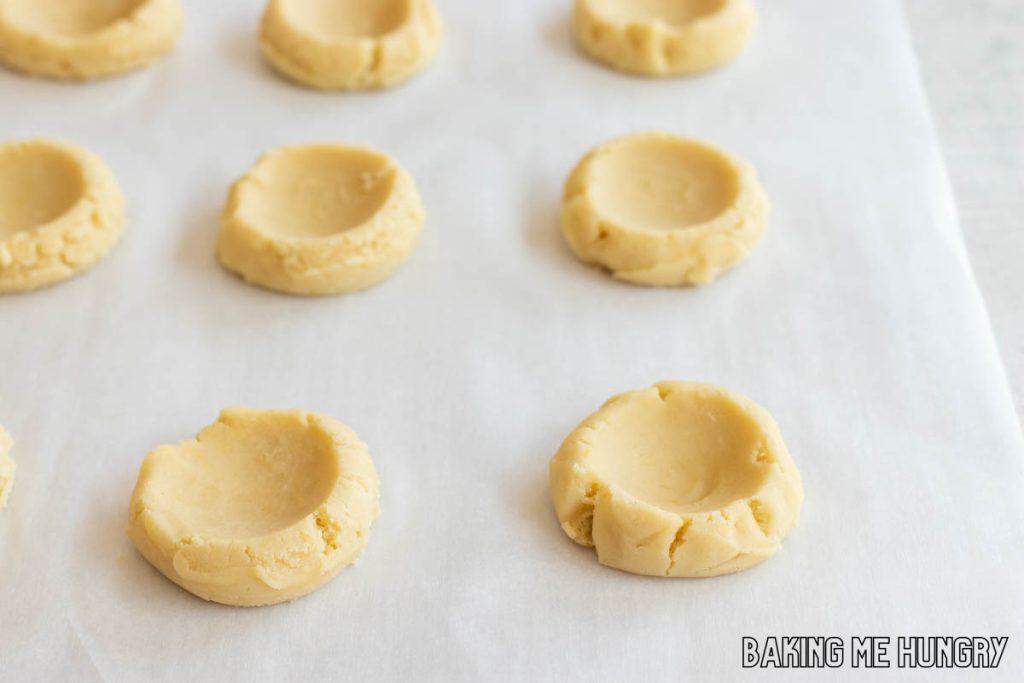 wells made in the centers of the cookies