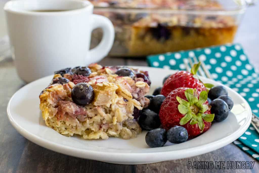 slice of baked oatmeal with rhubarb and berries on a plate