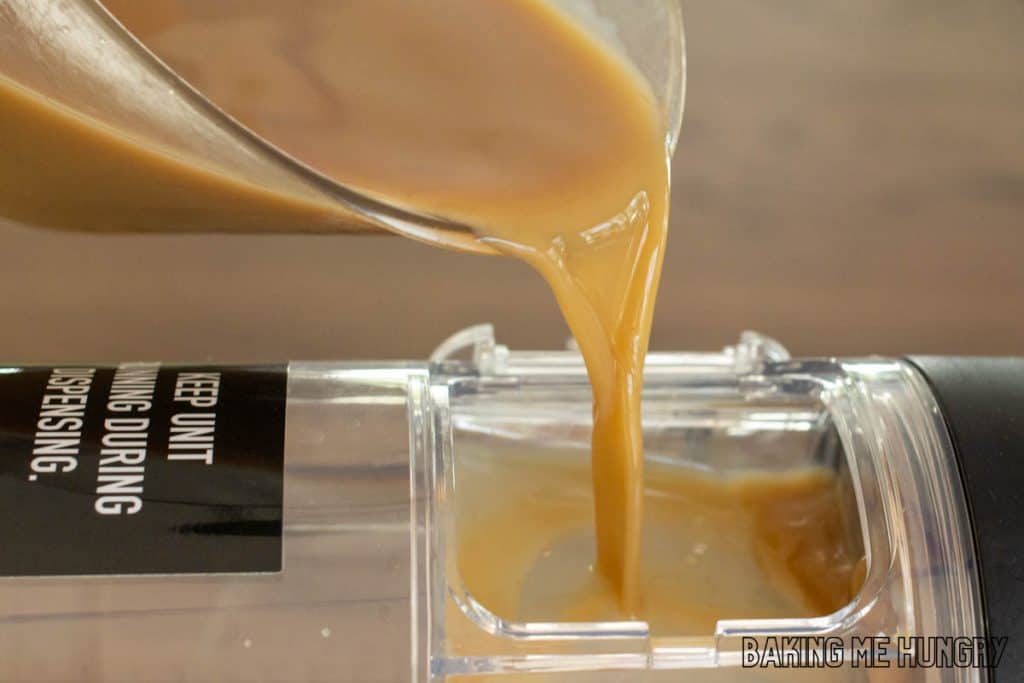 coffee mixture being poured into slushie machine