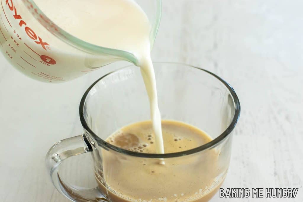 milk being poured into mug