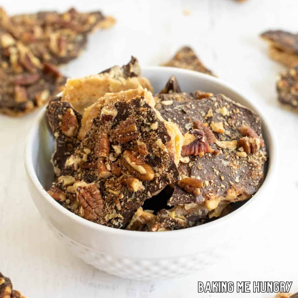 pretzel crack recipe in bowl with pieces around it