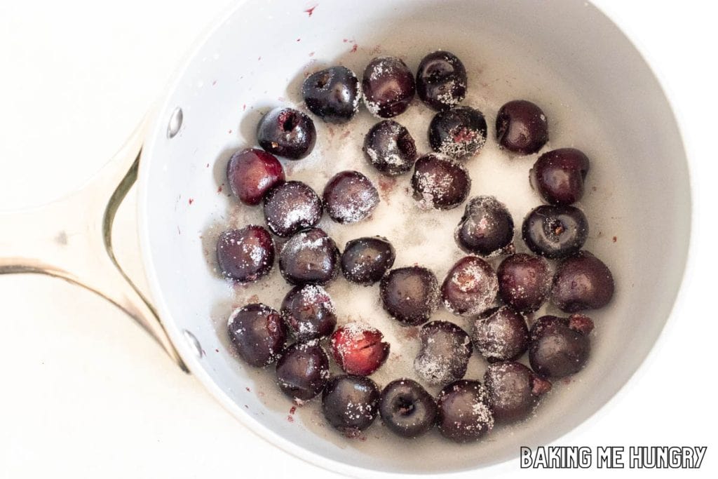 cherries and sugar in pot