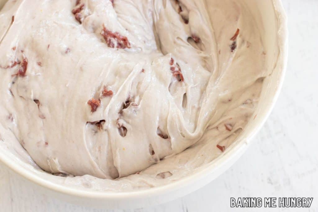 batter with cherries in bowl
