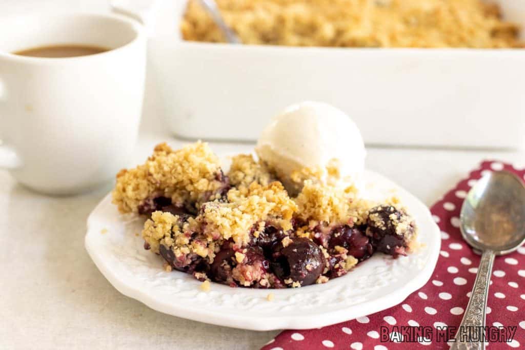 fresh cherry crumble recipe served with vanilla ice cream