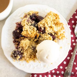 fresh cherry crumble recipe served with vanilla ice cream from overhead