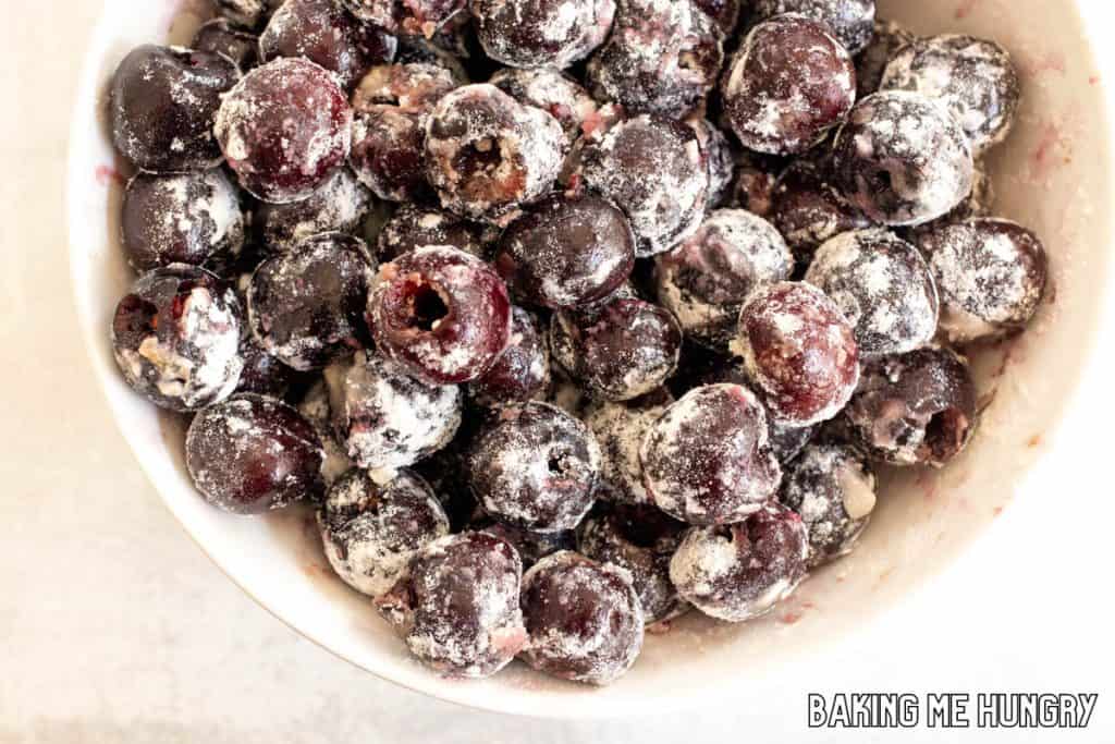 cherries mixed with flour in bowl