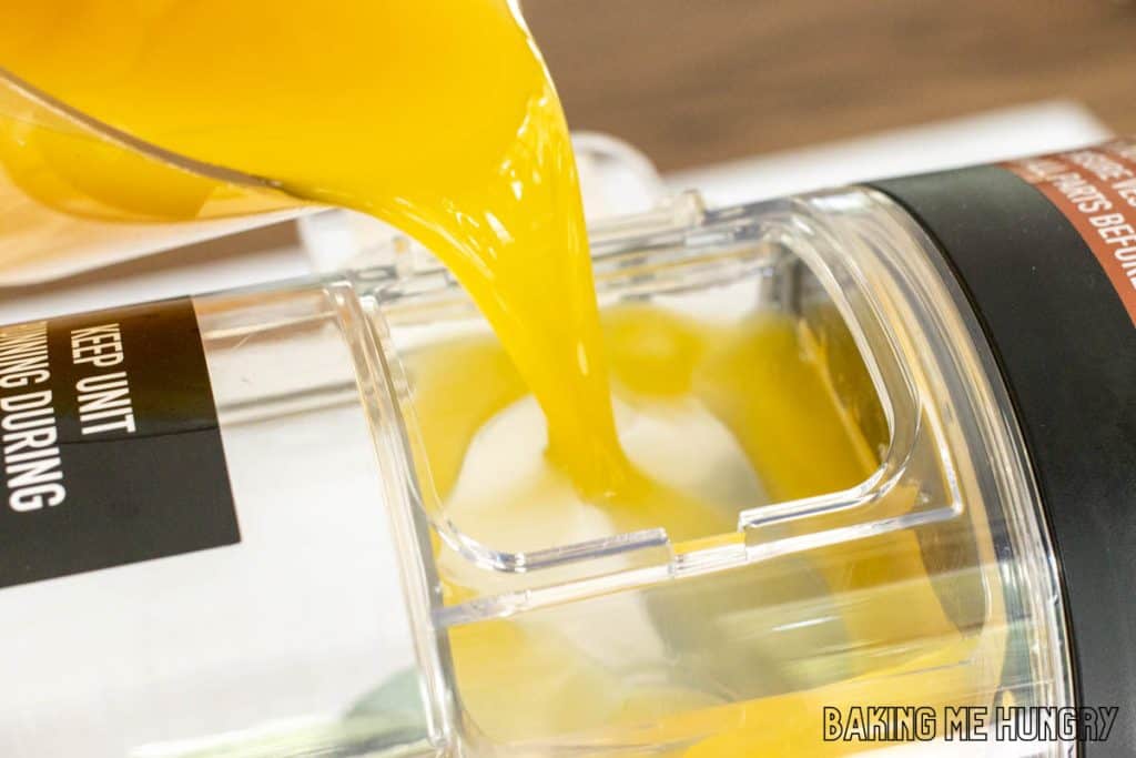 juice being poured into slushi machine
