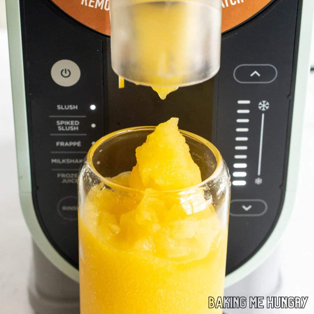 mango slushy recipe mango slushy recipe being dispensed from ninja slushi machine close up