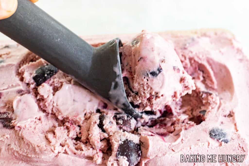 ice cream scoop scooping some of the amaretto cherry ice cream