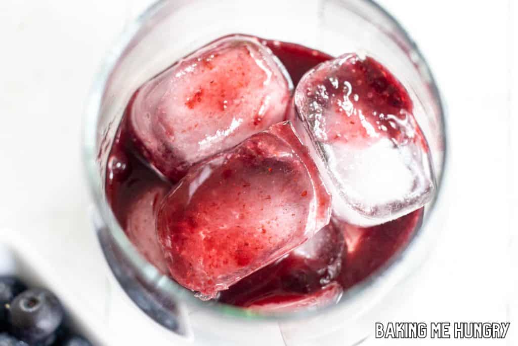 berry puree in glass over ice