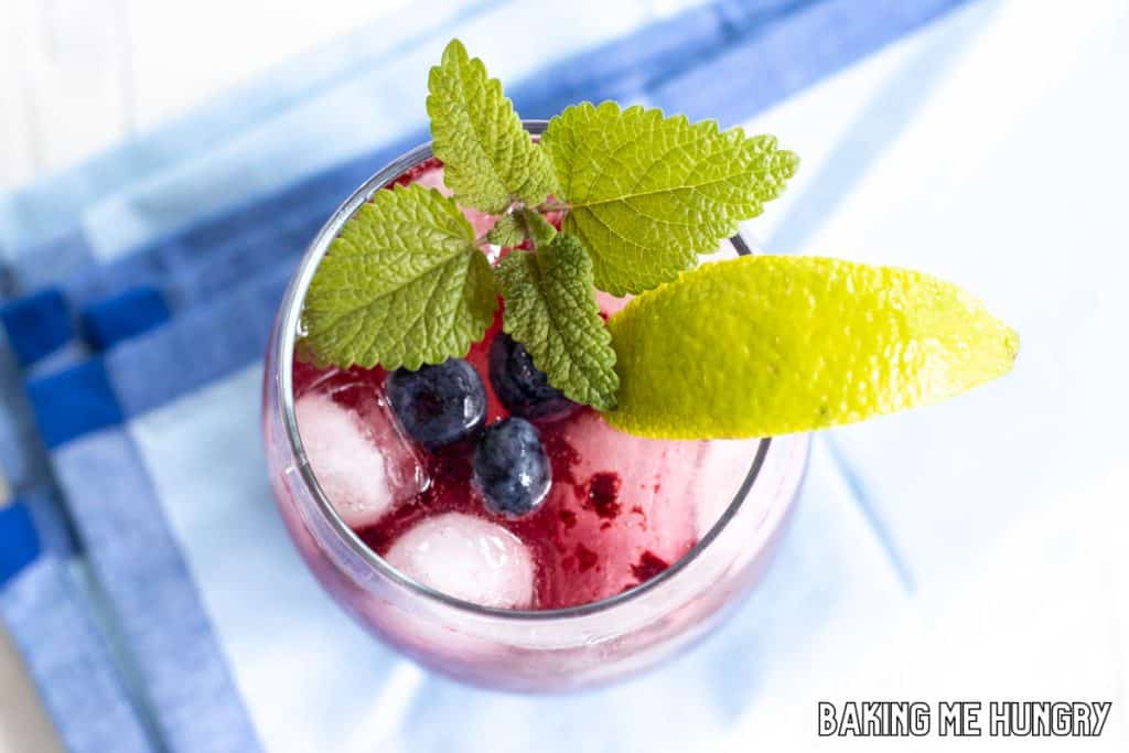blueberry mocktail on blue napkin from overhead