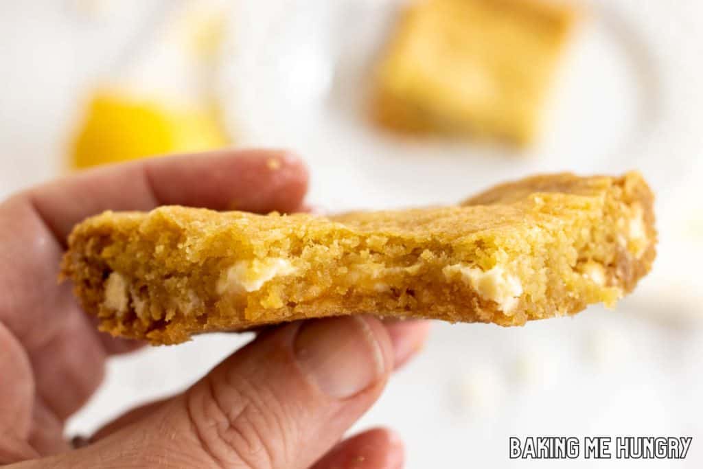 hand holding one of the lemon blondies