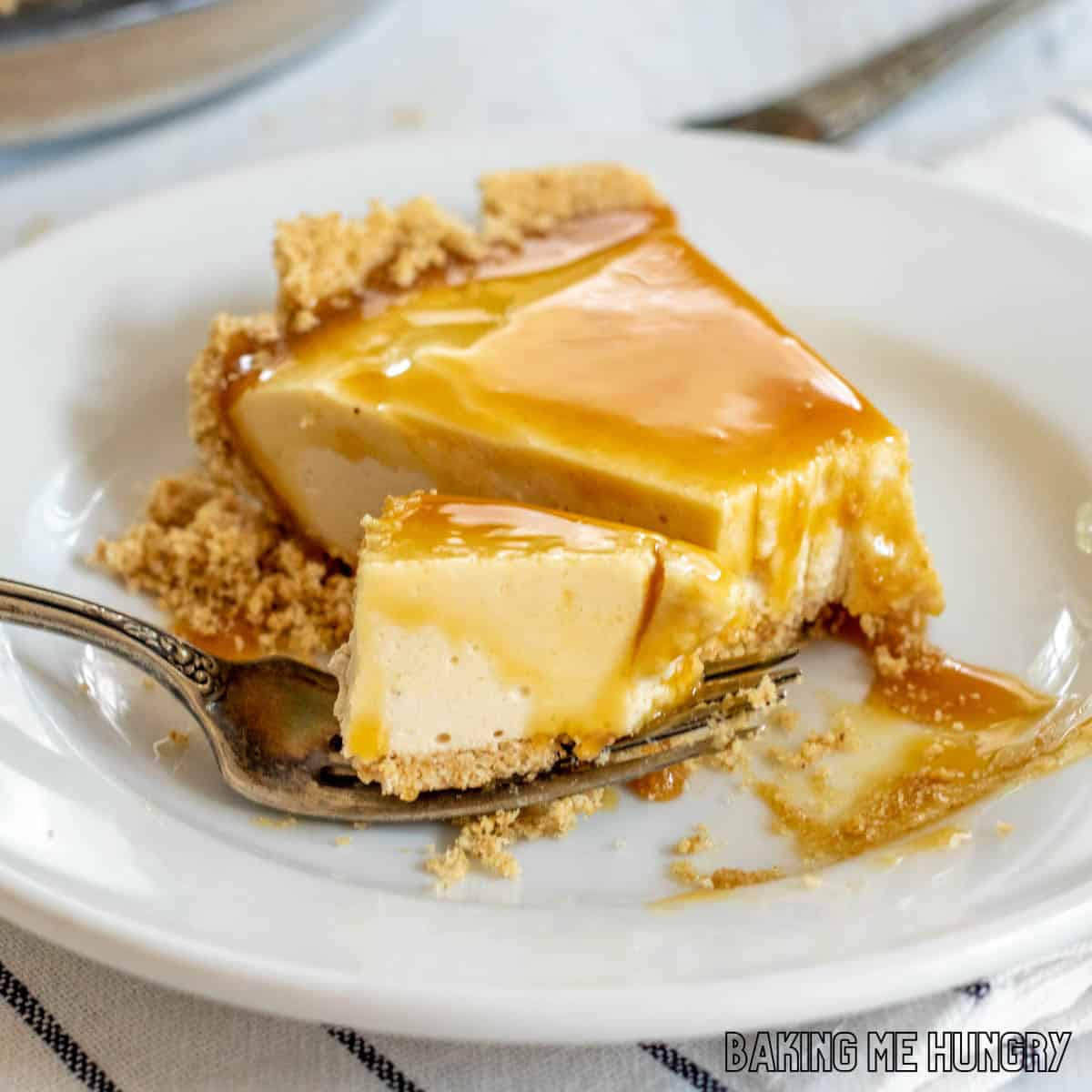 no bake caramel cheesecake slice on plate with a bite on a fork resting on the plate