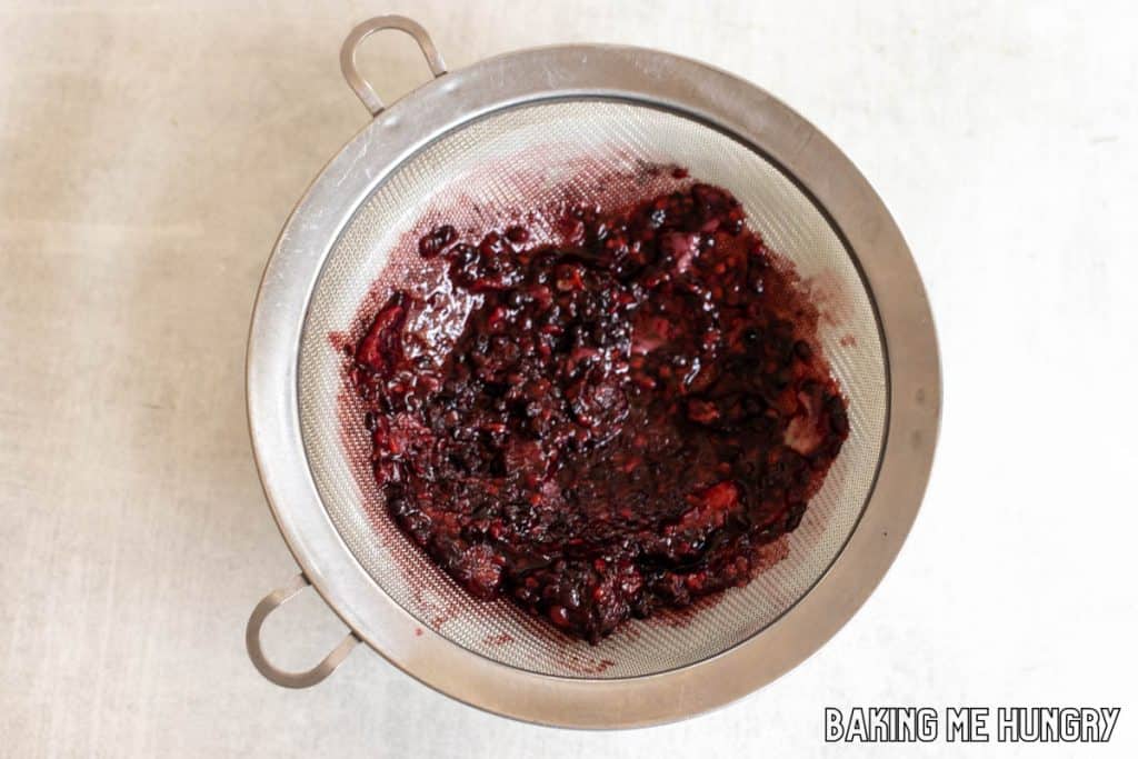 berries smashed in strainer