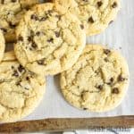 chocolate chip sugar cookies close up from overhead stacked on baking sheet
