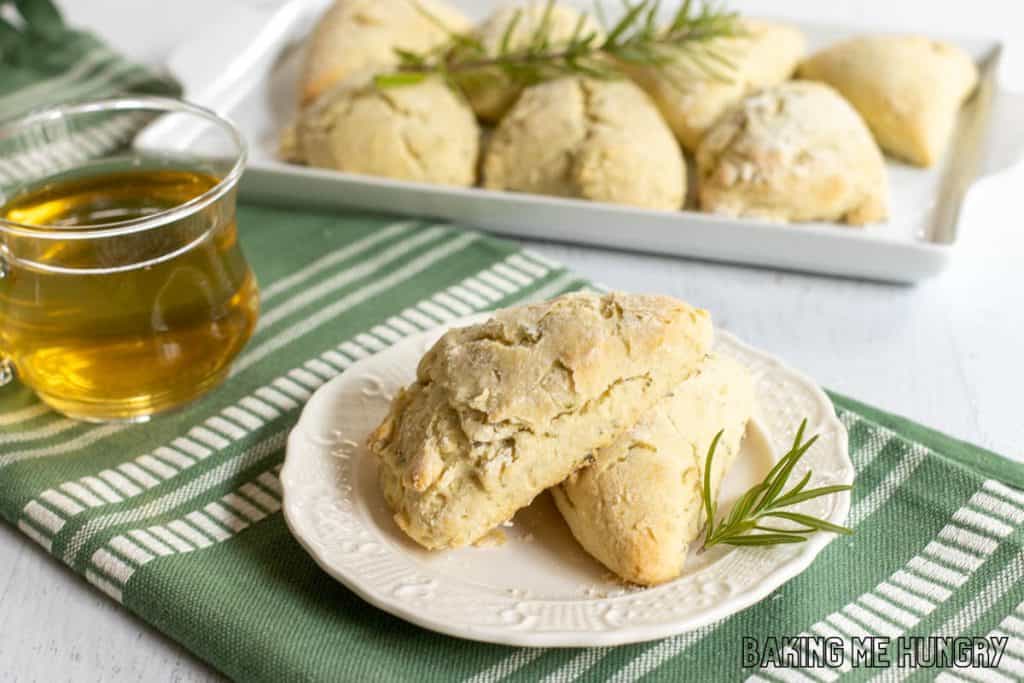 small plate of herb scones with platter behind