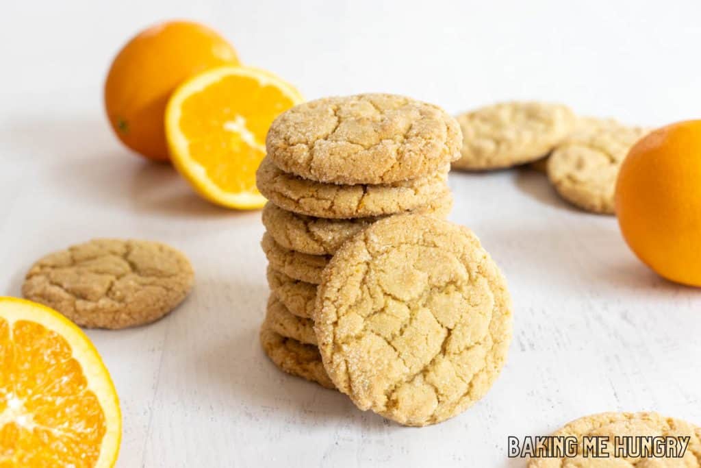 stack of orange sugar cookies with one leaning on it