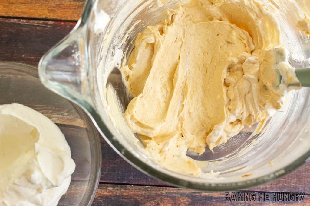 bowl with cream cheese mixture and bowl with whipped cream
