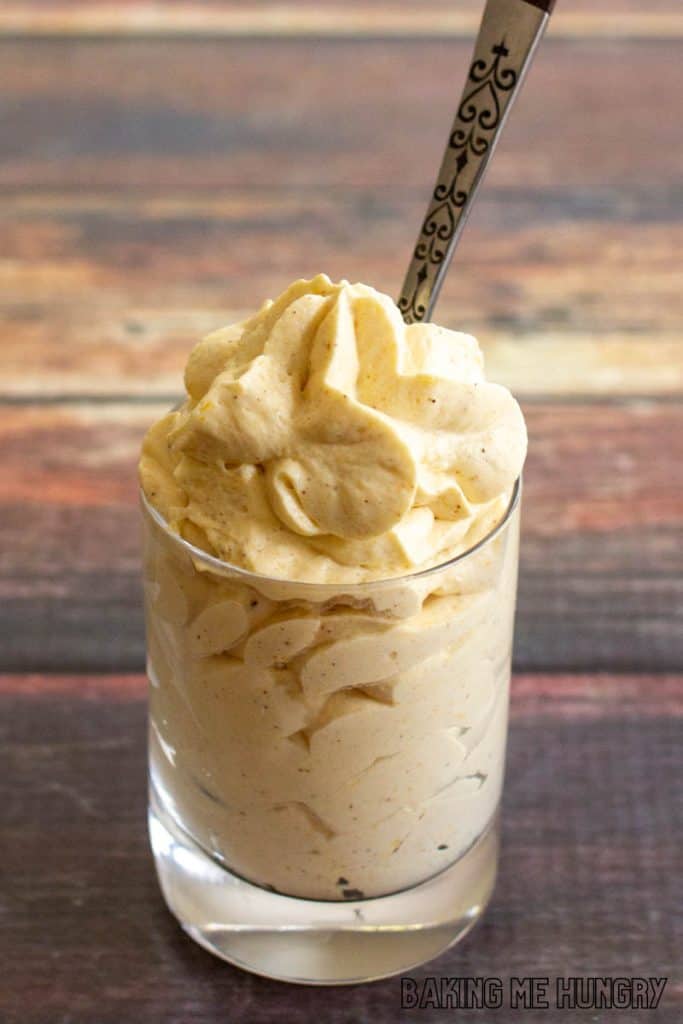 shot glass with whipped dessert and spoon