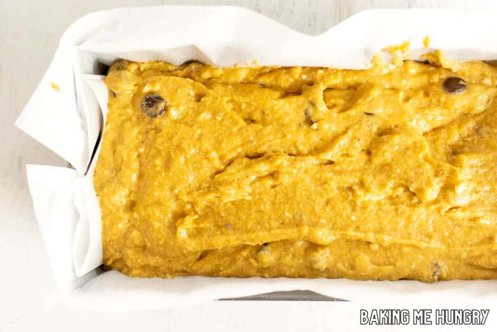 batter in parchment lined loaf pan