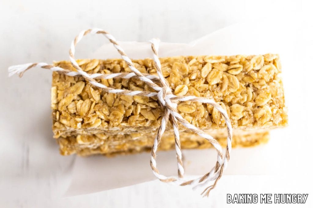 honey oat bars in a stack from overhead wrapped in parchment paper and tied with twine