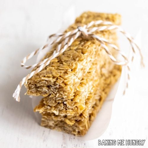 honey oat bars in a stack wrapped in parchment paper and tied with twine